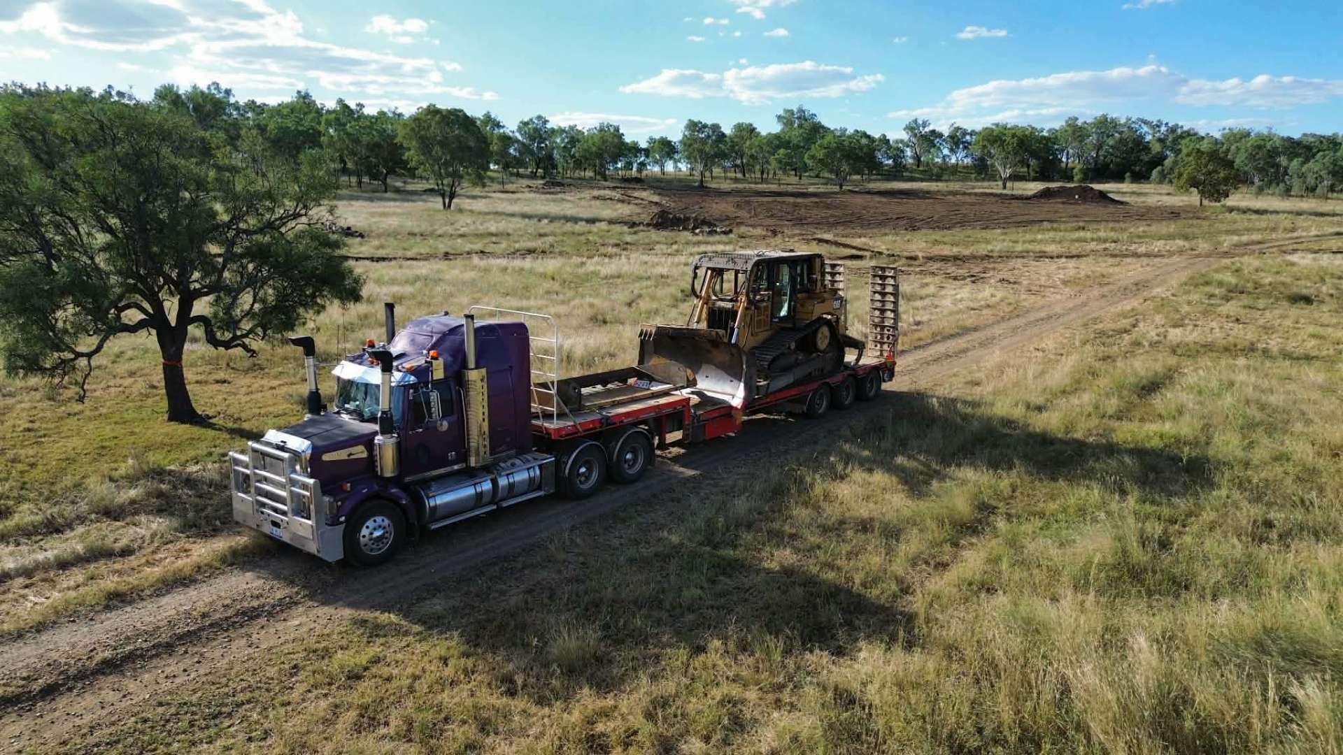 Western Star prime mover floating a CAT D6 dozer to a rural job